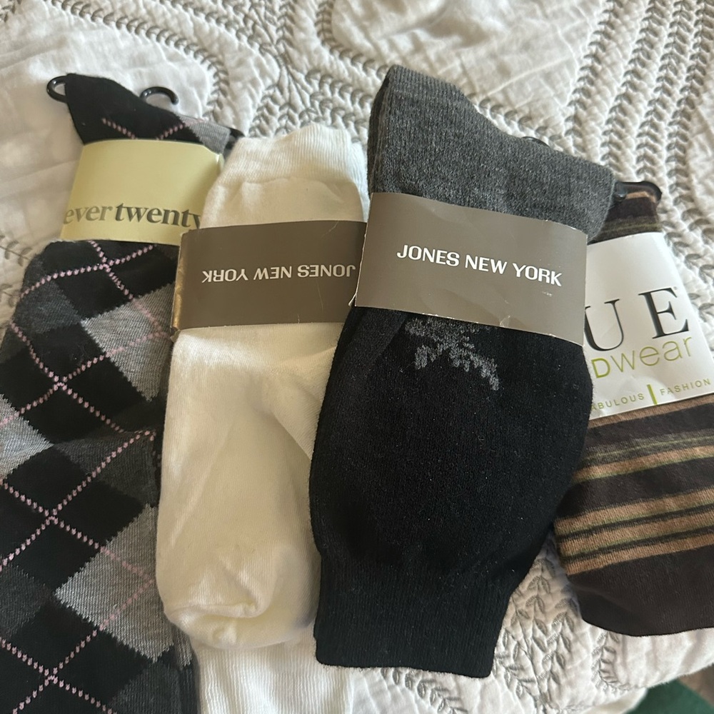 Variety of socks. Total pairs are 2 white one solid black , one argyle and 2 hue